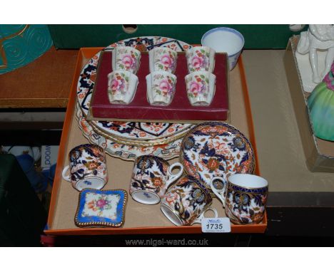 A set of six Crown Derby cups/egg cups, a small German floral trinket dish and lid, four tiffany coffee cans and saucers, fou