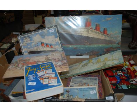 Four wooden jigsaw puzzles including Victory Cunard Queen Mary, Empress of Britain, Fairey Swordfish Aircraft and Chad Valley
