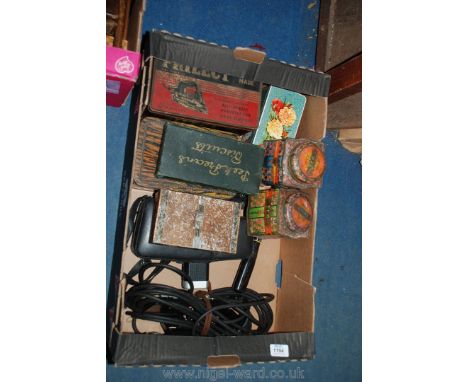 A quantity of tins to include a Prillect iron tin, a Cadbury Bourneville, DoDo canisters for tea and sugar, an Agfa Movie zoo