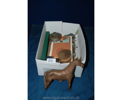 A box of miscellaneous items including fishing flies, stapler, steel tool, desk calendar, etc