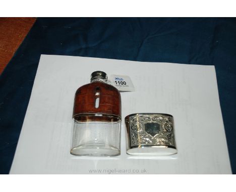 A leather bound hip Flask with removable plated base