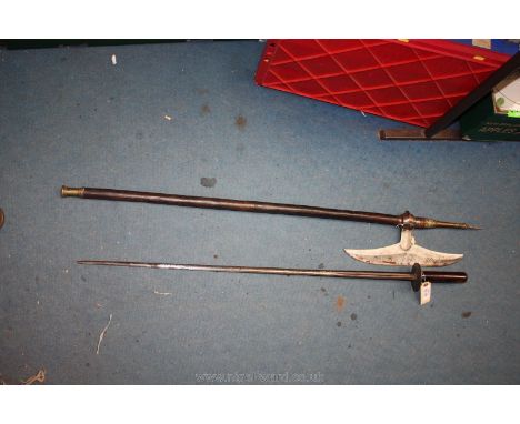 A late 18th c. Rapier, plain wooden grip with brass knuckles and Shield and African Axe with decorative brass terminals to sh