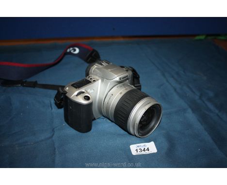 A Canon EOS 300 35mm autofocus SLR Camera with a 28-90mm Zoom Lens and original strap.