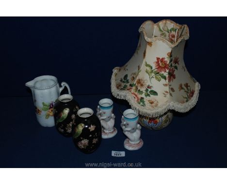 A floral patterned table lamp, a pair of Windsor Art ware vases with budgerigar decoration, a pair of Victorian egg cups in t