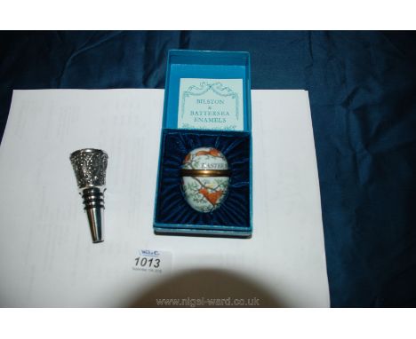 A modern Bilston enamel egg decorated with squirrels and a Royal Selangor pewter bottle stopper