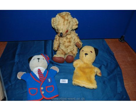 A 'Merrythought' Teddy Bear and a pair of Sooty and Sweep glove puppets