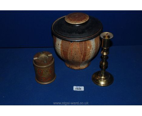 A 1970's hand made Studio pottery jar by Tim Galucci, Pennsylvania U.S.A., a small sweet tin, brass candlestick and a 1940's 