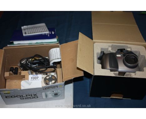 A Nikon digital Camera Coolpix 5200 together with a Toshiba PDR-M61 digital still Camera