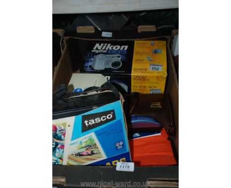 A Nikon digital 885 coolpix camera, a Minolta AF-S camera, a Polaroid One 600/classic camera, Tasco binoculars, etc