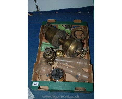 A box of oil lamp bases of unusual types including chimneys, burners, etc