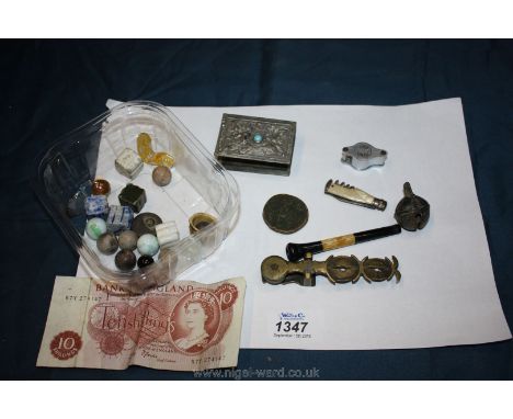 Miscellaneous items to include an Art Deco cigarette holder, old brass sovereign scales, marbles, etc