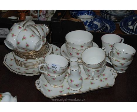 A large Duchess bone china part Tea and Dinner Service decorated with roses