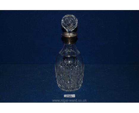 A crystal cut Decanter with silver collar, Birmingham hallmark