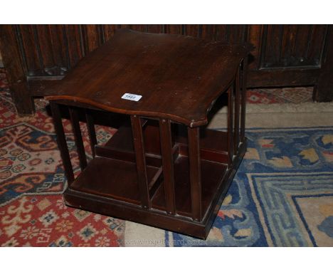 A Mahogany rotating Bookcase of compact dimensions, 14 1/2" square x 13 1/2" high.