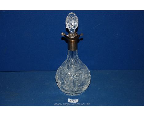A decanter with silver collar