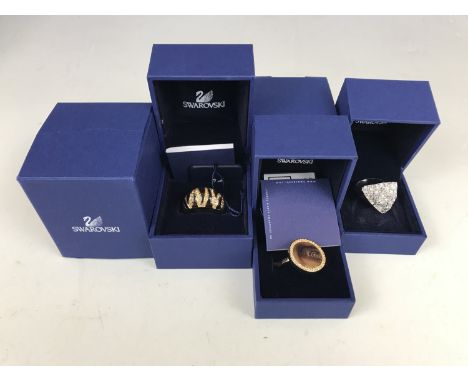 Three Swarovski dress rings in original packaging