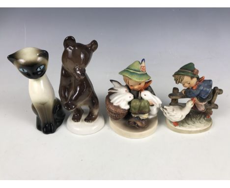 Two Hummel figurines together with a Lomonosov bear etc