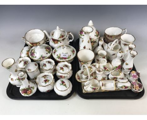 A large quantity of Royal Albert Old Country Roses ware including lidded trinket jars, a small teapot and vases etc