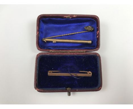 A Sampson Morden yellow metal fob slide pencil, a yellow metal tie / scarp pin and a Victorian stick pin stamped 15 ct and se