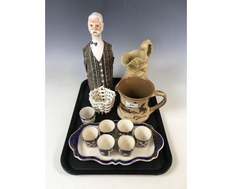A Pearlware lattice basket (a/f) together with an egg cruet, a slipware jug and The Bartender novelty decanter etc