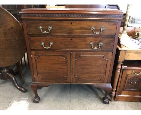 An early 20th century mahogany side cabinet, having caddy top with Greek key blind fret frieze, above two long drawers with r