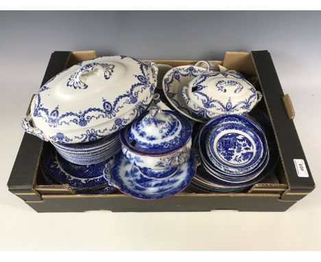 A large quantity of blue and white including Willow pattern plates, a teapot, various jugs and tureens etc 