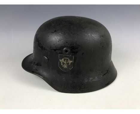 A German Model 1940 style steel helmet with Third Reich police decal, (liner post-War Norwegian)