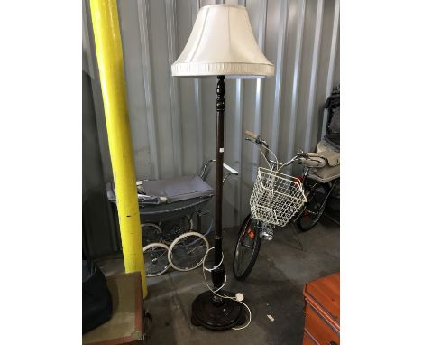 A turned mahogany standard lamp