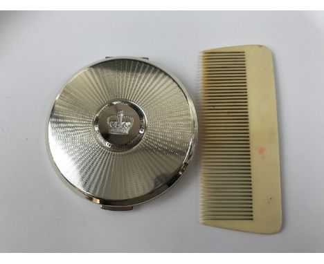 A Stratton pressed powder compact together with an early 20th Century Ivorine comb 
