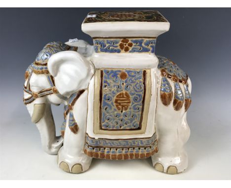 A ceramic elephant stool
