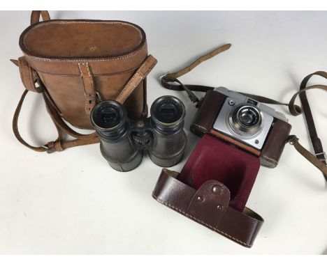 An early 20th century set of binoculars and an Ilford camera