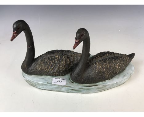 A Brenda Dennis ceramic black swan figural group (a/f)