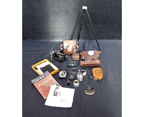 A LEICA THREE SERIES CAMERA No 523642, body only, in leather case, with another camera, a box of glass plates, and other phot