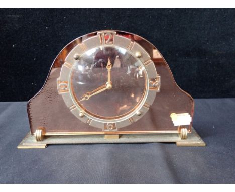 AN ART DECO PEACH GLASS CLOCK 