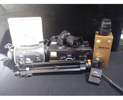 NIKON D5100 CAMERA WITH ALL ACCESSORIES with a Nikkor Zoom Lens 18-200 and a Cullman tripod, carry bags etc