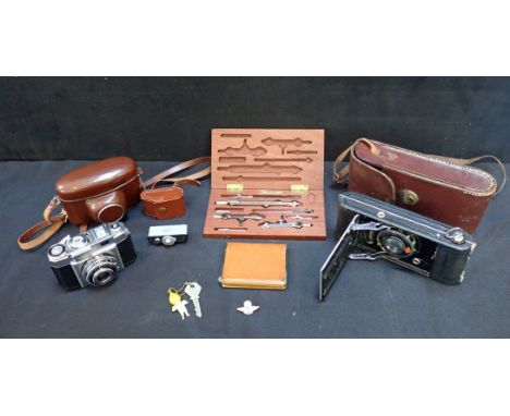 A ZEISS IKON CONTINA CAMERA with Novar Anastigmat (cased) with an Agfa camera, a precision drawing set and  other sundries