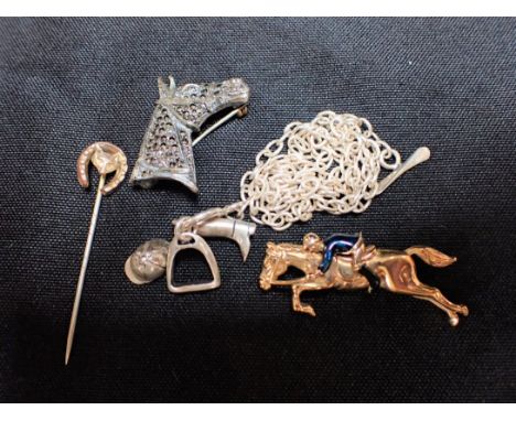 FOUR ITEMS OF EQUESTRIAN THEMED JEWELLERY two brooches, a foxhunting stick pin, and white metal charms on a chain