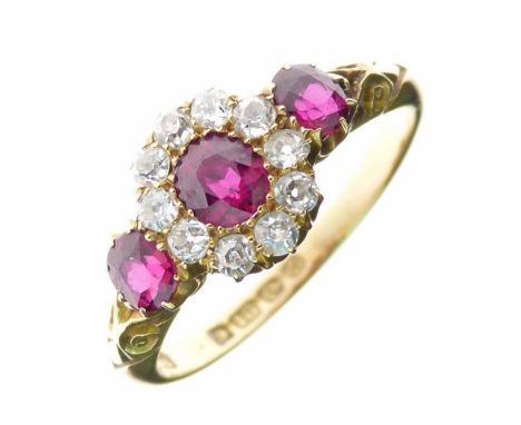 Edwardian ruby and diamond 18ct gold ring, Birmingham 1905, the central oval cut stone, 4.3mm x 4mm, enclosed by ten old cut 