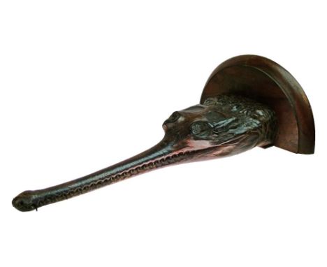 Taxidermy - The head of a young Gharial (Gavialis Gangeticus), mounted as a wall shelf with a demi lune walnut top, overall h