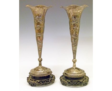 Pair of Chinese export silver trumpet shaped specimen vases, circa 1900, each having embossed dragon decoration, 26.5cm high 