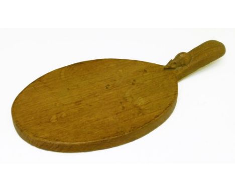 Robert 'Mouseman' Thompson oak cheese board of oval form, the handle typically carved with a mouse, 36.5cm long  Condition: *