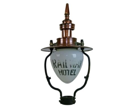 Large early 20th Century copper and wrought iron gas lamp head, the clear and white glass dome shaped shade with script 'Rail