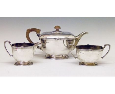 George VI silver three piece tea service, each piece standing on a shaped rectangular foot, makers Frank Cobb & Co, Sheffield