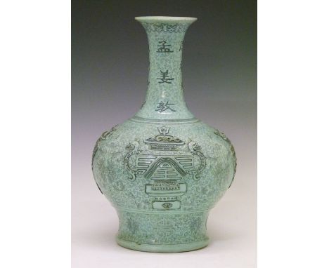 Chinese pale green glazed porcelain bottle shaped vase decorated with archaic vessels together with symbols of good luck and 