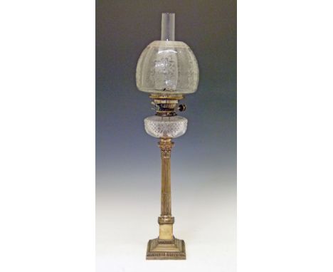 Early 20th Century oil lamp having a cut glass reservoir and standing on silver plated Corinthian column base, clear etched g