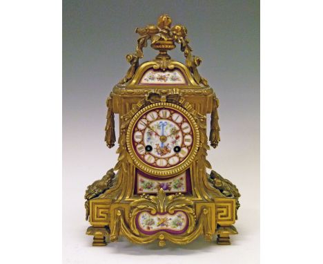 19th Century French ormolu and porcelain mantel clock, the case with urn finial, cast foliate swags, Sevres style porcelain d