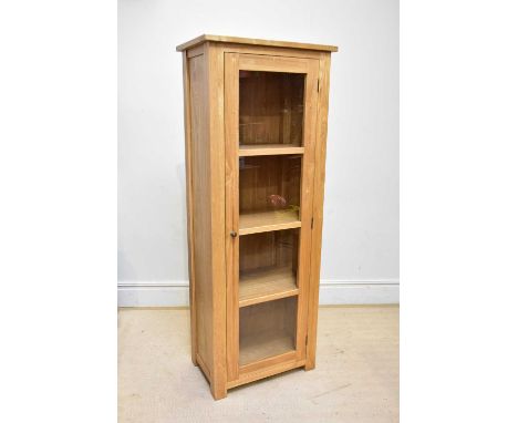 A modern light oak display cabinet, with single glazed door, height 184cm, width 70cm.
