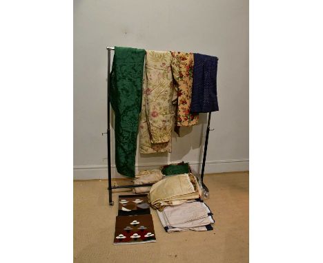 A large crewelwork cream and blue tapestry cushion, a small green jacquard cushion with fringed edge made by Watts of Westmin