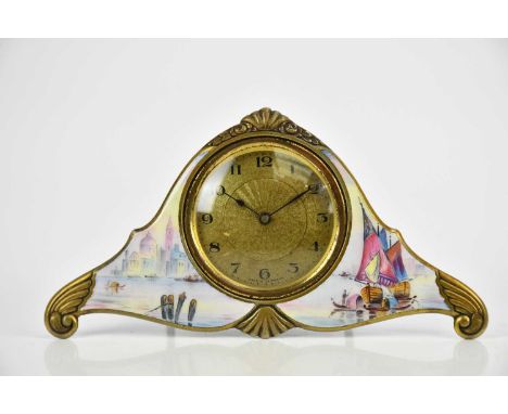 A German enamel easel back dressing table timepiece, the engine turned dial set with Arabic numerals and enamel decoration of
