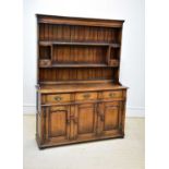 TITCHMARSH & GOODWIN; a reproduction oak dresser, with boarded plate rack above three drawers and